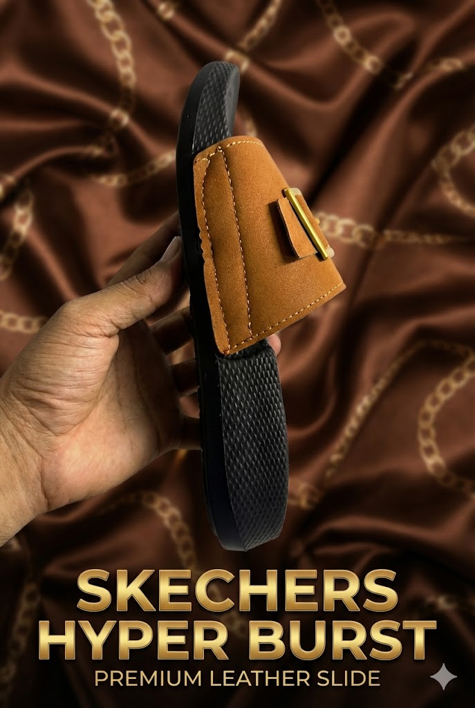 Side profile of a matte leather slide showing the thick black Hyper Burst foam sole and premium gold buckle detailing.